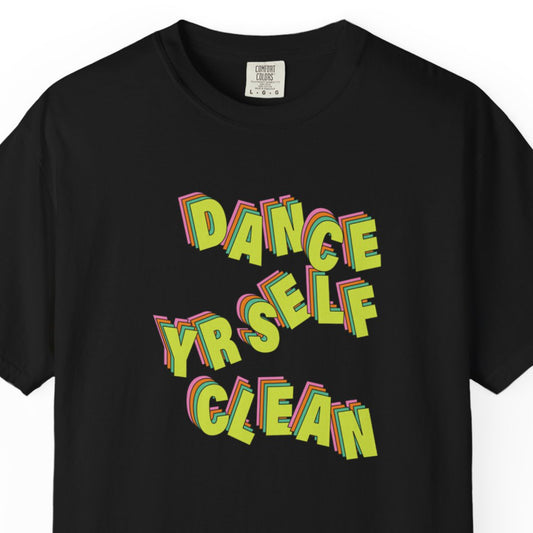 A black short-sleeve t-shirt with a colorful graphic text print reading 'DANCE YRSELF CLEAN' in a layered 3D retro font. The shirt is shown flat against a white background, with a visible neck label for Comfort Colors.

LCD Soundsystem band merch t shirt dad funk